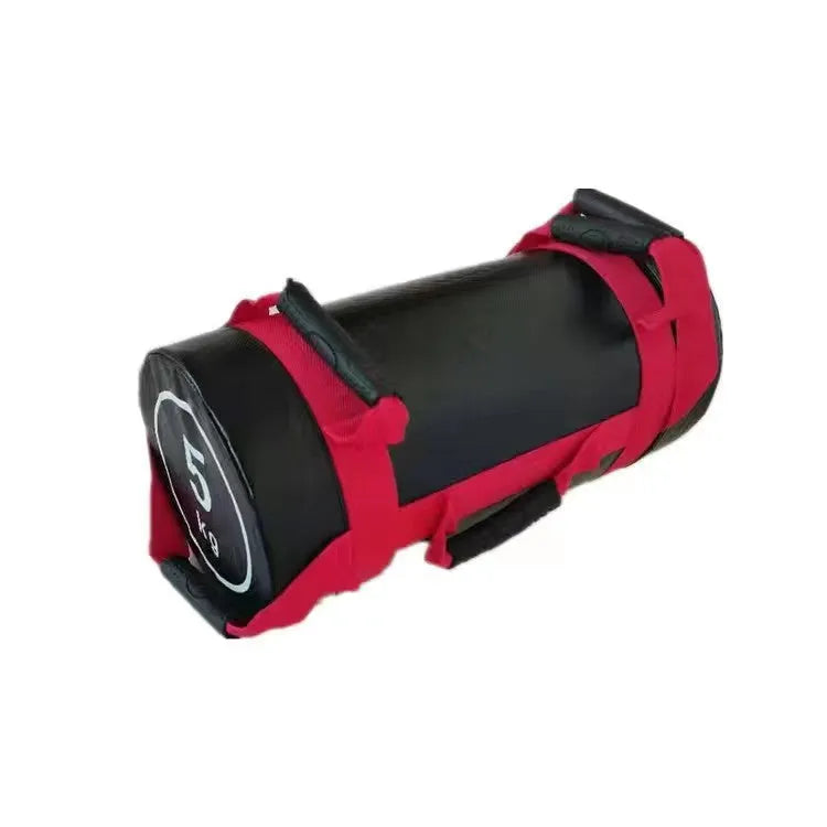 Flat white leather PVC fitness training sandbag shown in a gym setting for weight lifting and conditioning.