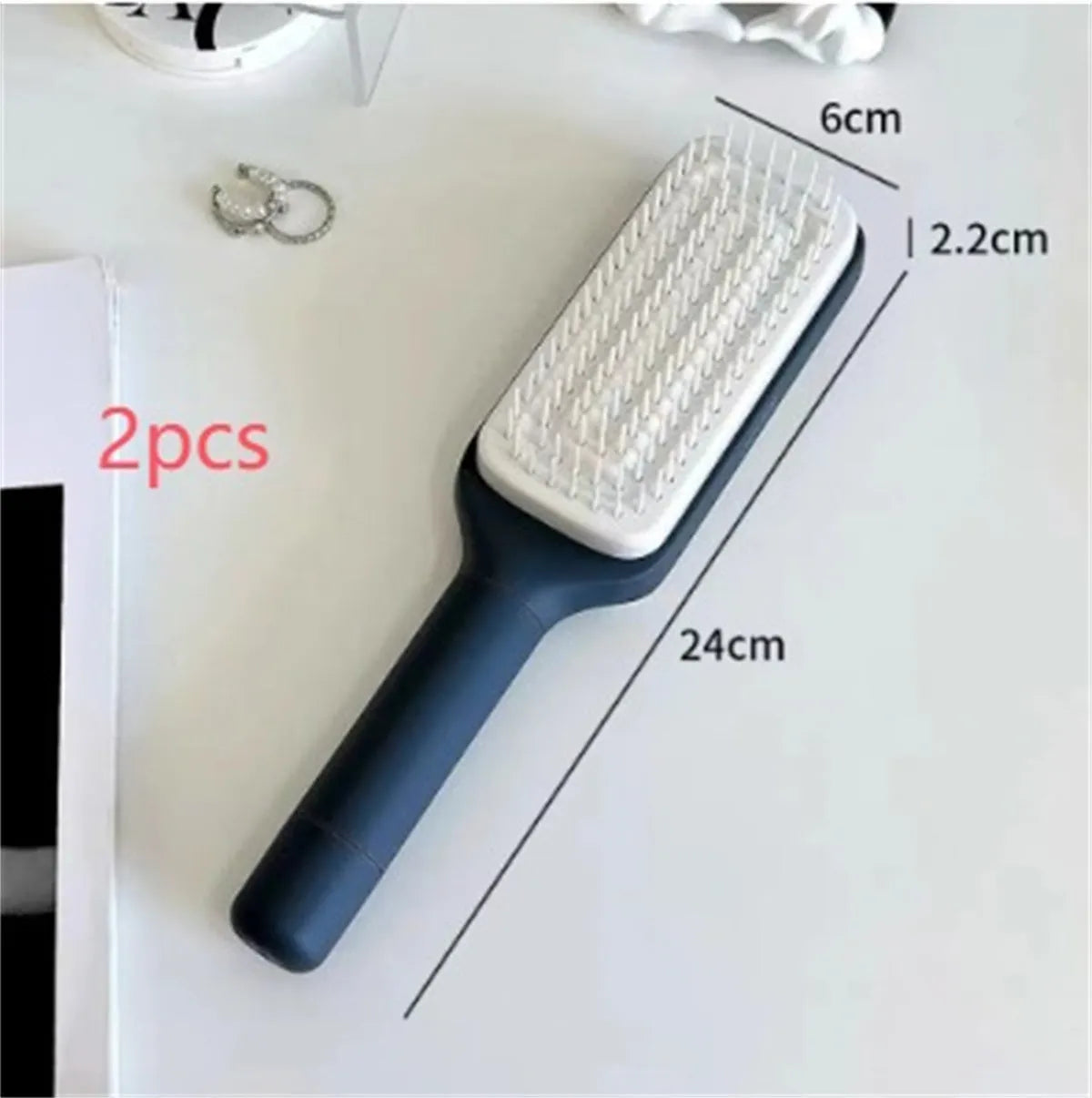 Roland purple self cleaning hair brush with rotating handle and anti-static bristles