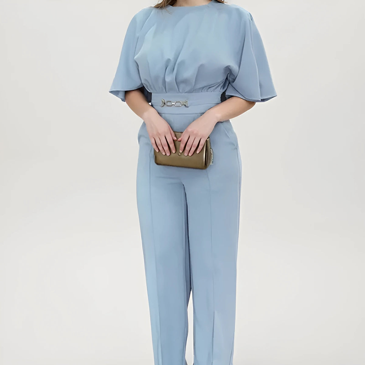 Blue men's slim fit two-piece polyester suit with long sleeve jacket and trousers on a hanger.