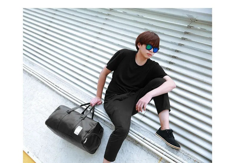 Black unisex waterproof sports gym bag with a separate shoe compartment shown in two size options.