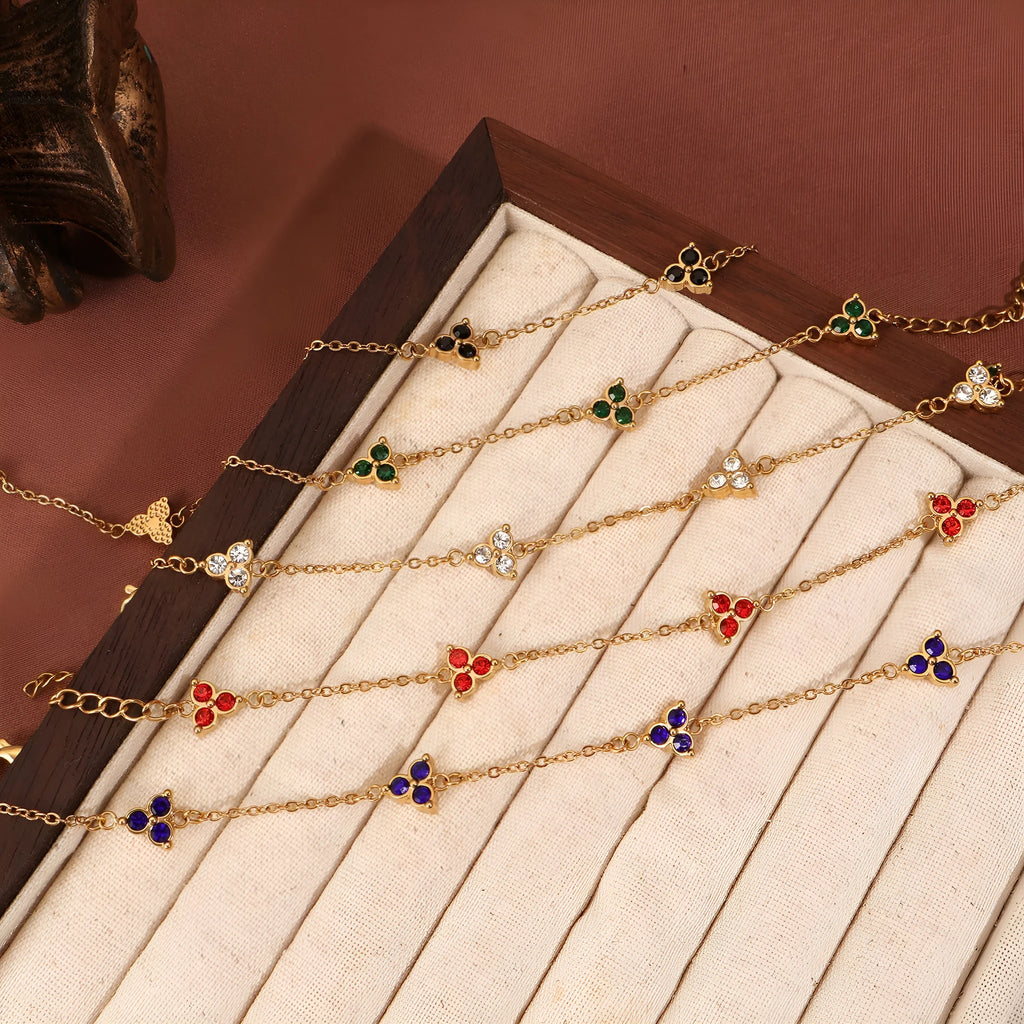 Women's geometric stainless steel bracelet with three-diamond triangle design and zircon stones