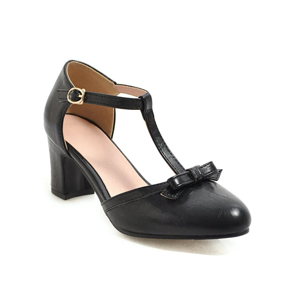 Women's apricot chunky heel sandals with hollow out design, bow tie, and a single buckle strap.