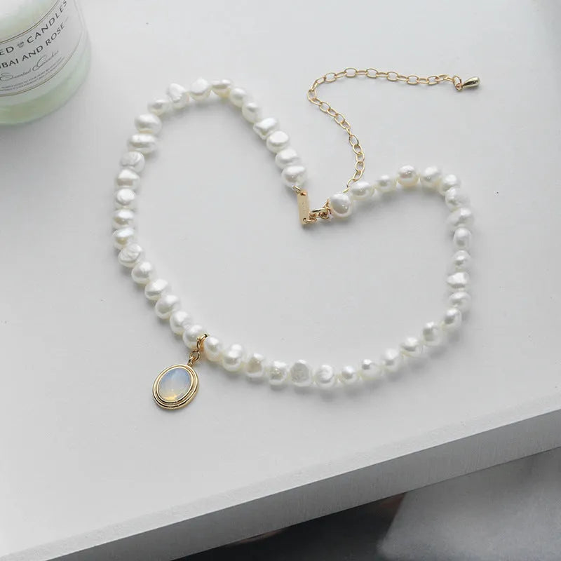 Geometric sterling silver pendant necklace with irregular freshwater pearls on an adjustable silver chain