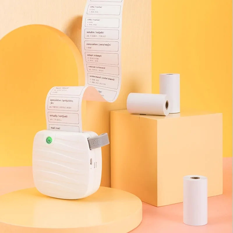 Three rolls of 57mm thermal paper in packaging for small printers