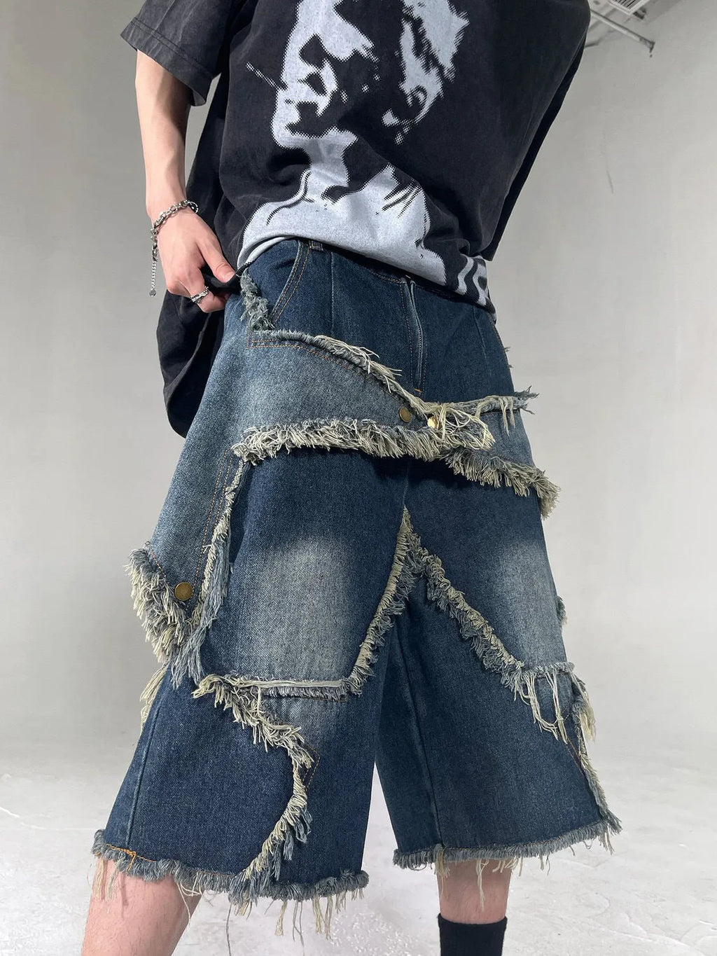 Blue denim shorts with frayed details and five-pointed star design, loose fit summer shorts