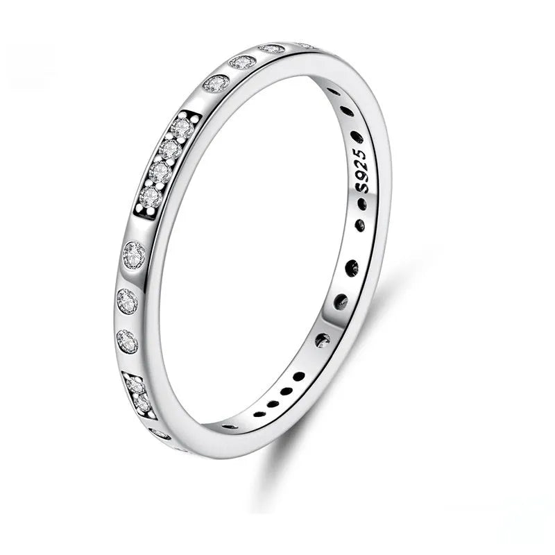 Sterling silver I Love You ring with oxidised black finish and moss knot design on a finger.