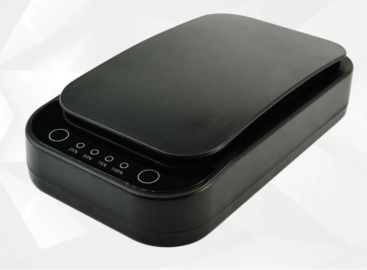 A black or white wireless UV disinfection box for mobile phones, showing phone inside.