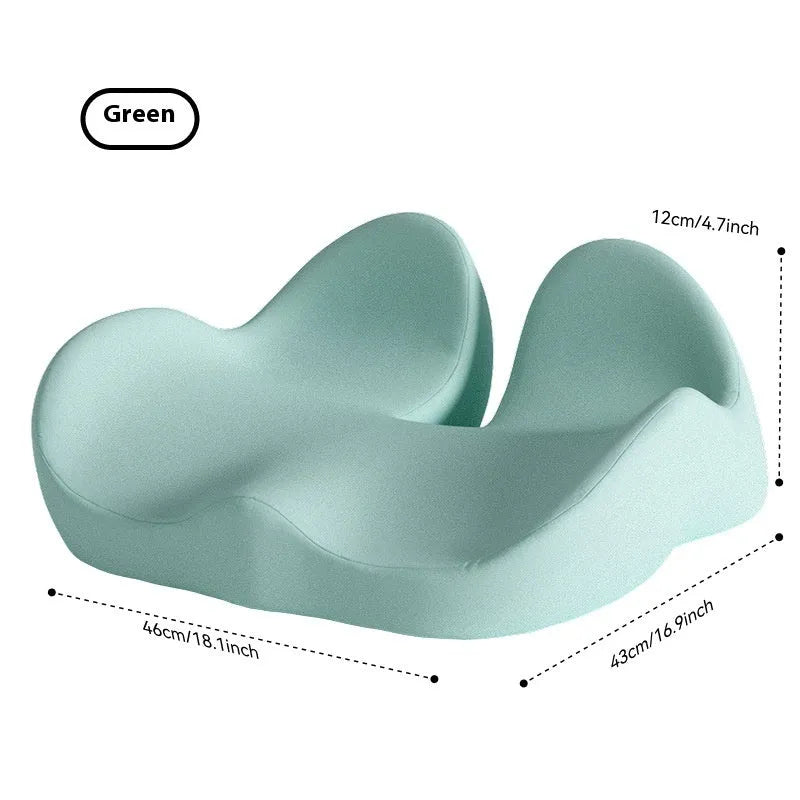 Memory foam office chair cushion in light grey on a desk chair.