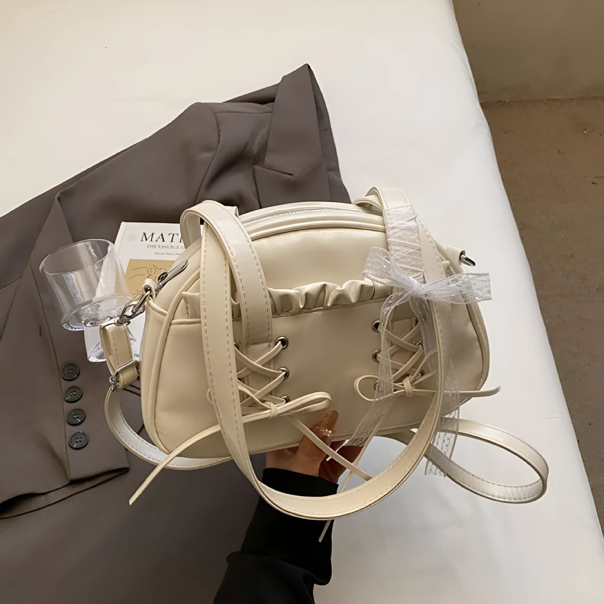 Ladies casual shoulder bag with bandage bow detail and internal mobile phone compartment