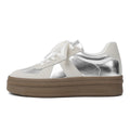 Retro milky white board shoes with cross shoulder straps and round toe on a rubber sole