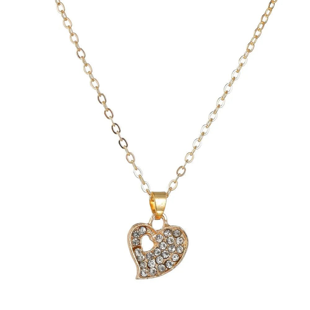 Women's gold colour alloy jewellery set with earrings, pendant and adjustable chain