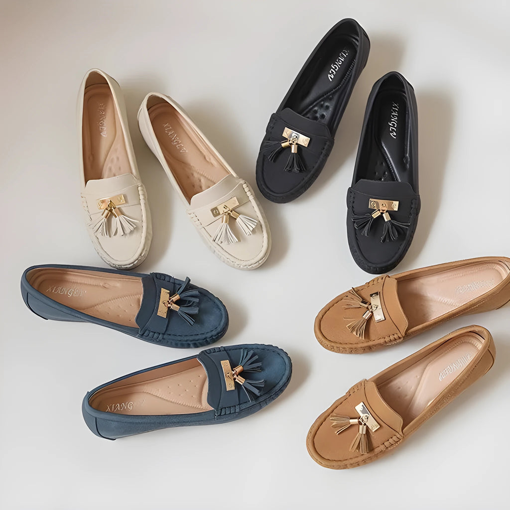 Beige oversleeve heel height increasing shoes with round toe on a white background.