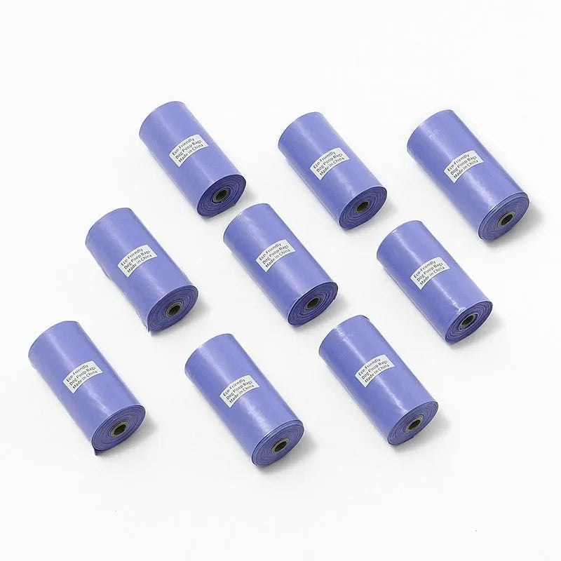 EPI degradable pet waste bag rolls in green, black, blue, and orange colours with a capsule dispenser.