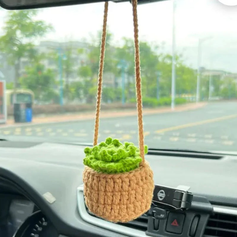 Green and white knitted wool car plant decoration with plastic base and hanging rope