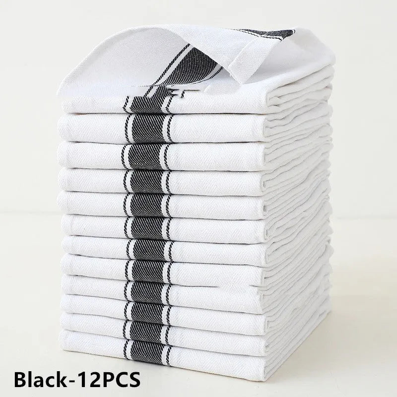Set of 12 striped cotton dish towels in mixed colours including black, blue, brown, yellow on a kitchen surface