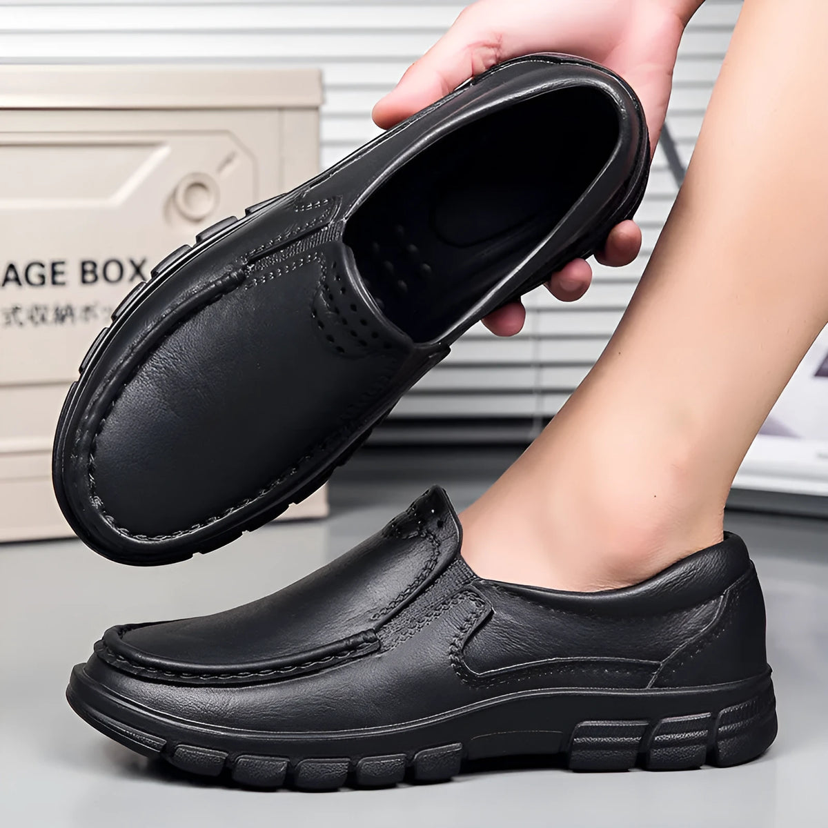 Men's black slip-on casual shoes with a round toe and chunky waterproof platform sole.