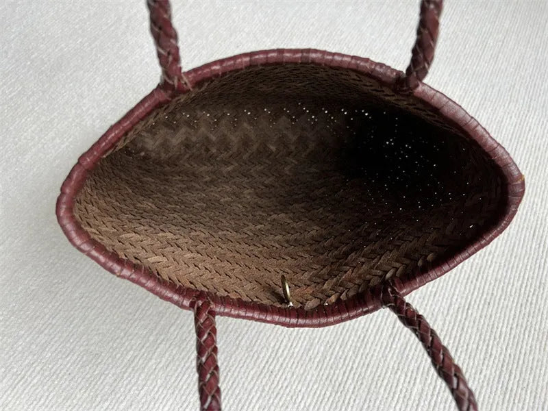 Brown woven genuine leather tote bag with a three-dimensional front pocket.