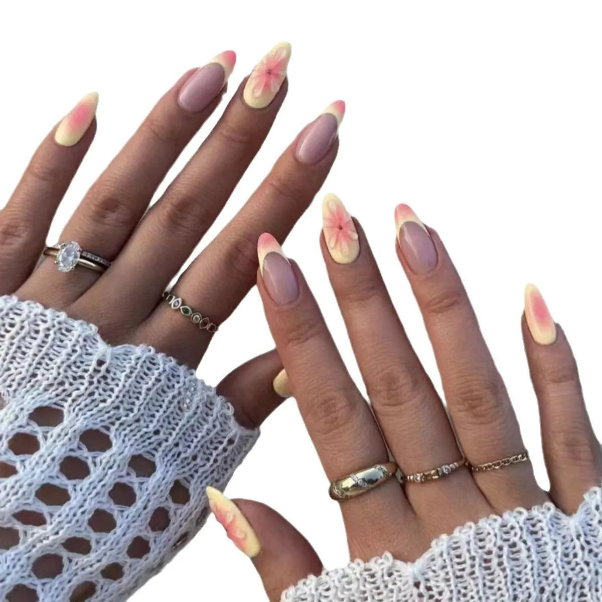 Simple fake nails set with pink and white 3D cartoon flower designs on detachable plastic armour pieces.