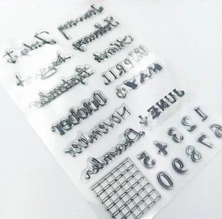 Close-up of a transparent silicone vintage calendar and digital table icon stamp on a white background.