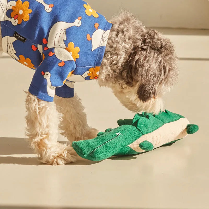 Green plush toy dog measuring 35cm long on a white background