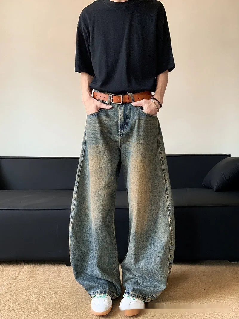 Men's retro blue distressed denim jeans with wide-leg trouser design and micro-elastic fabric
