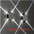 Modern square or round LED aluminium wall light with iron shade showing warm white illumination