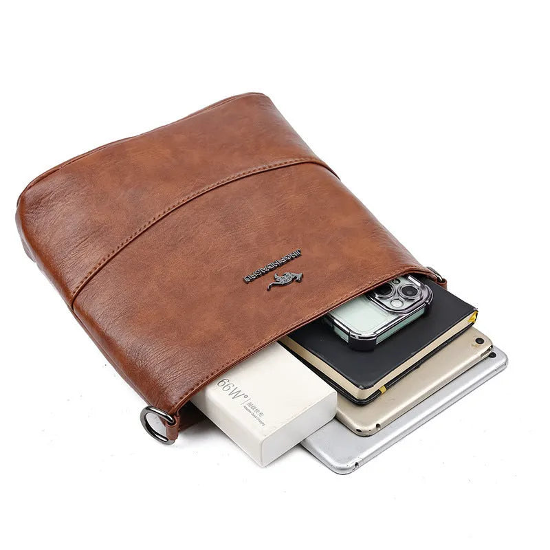 Women's leather bucket shoulder bag in solid colour with phone pocket and sandwich pockets
