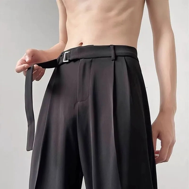 Thin straight wide leg loose fit trousers in black, showing the straight leg opening and casual drape