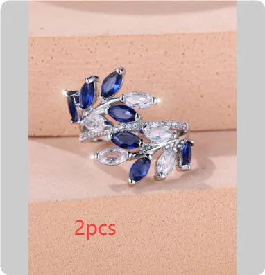 Adjustable horse eye zircon leaf ring in rose gold or platinum plating on a model's hand.