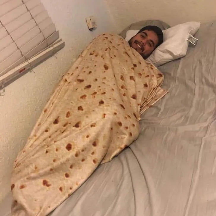 Round burrito blanket with coral fleece texture and food-themed print