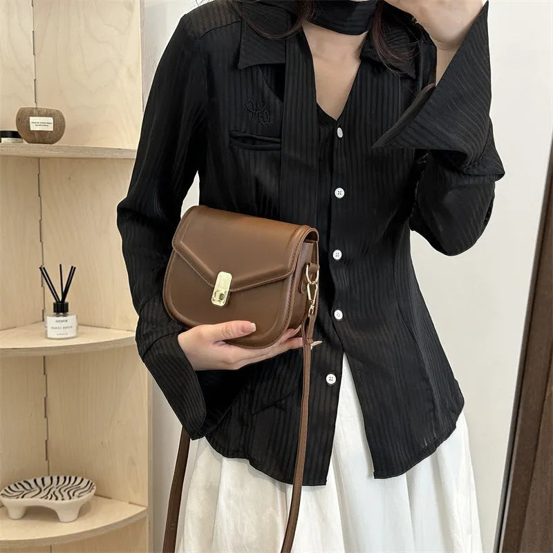 Soft PU leather clamshell shoulder messenger bag in a horizontal square shape.