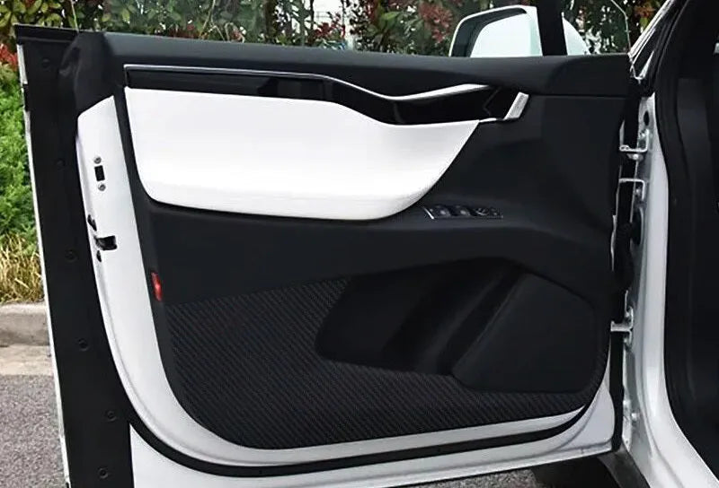 Carbon fibre pattern protective film for Tesla Model S car door interiors.