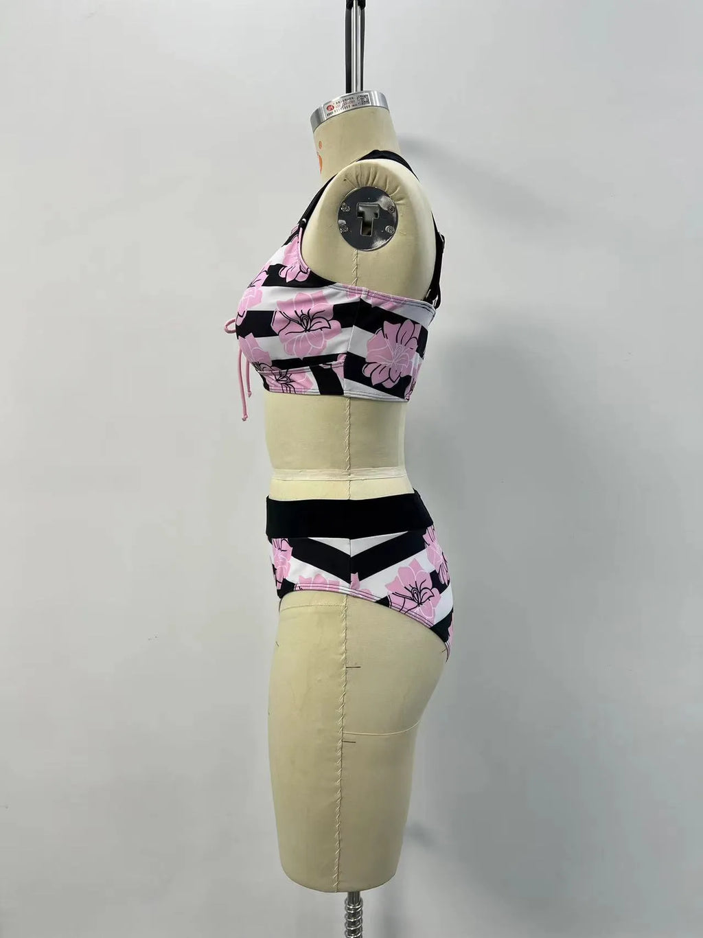 Black women's high-waisted bikini with a slimming belly-covered brief and split top.