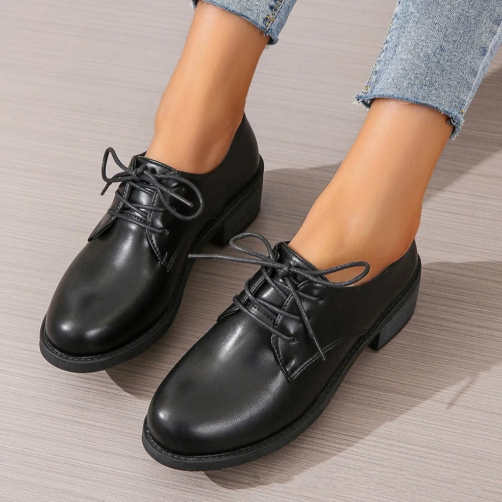 Black women's professional work shoes with chunky heel and pointed toe design