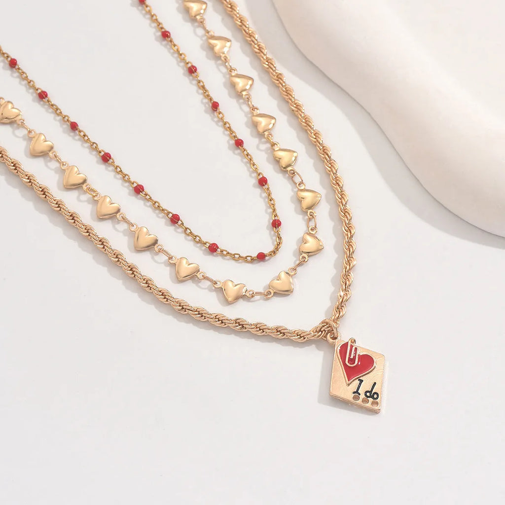 Golden three-layer adjustable clavicle chain necklace with geometric heart pendant