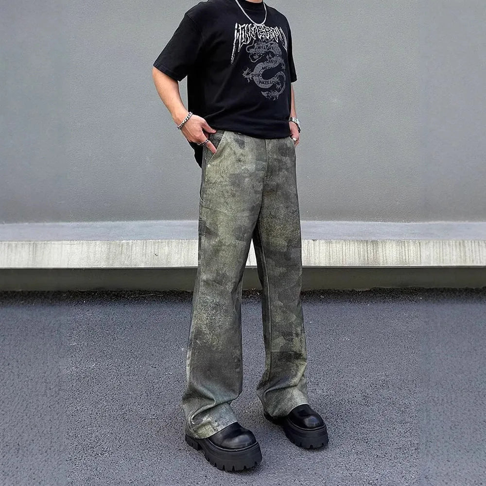 Men's straight-leg jeans with a digital camouflage print on blue denim fabric.