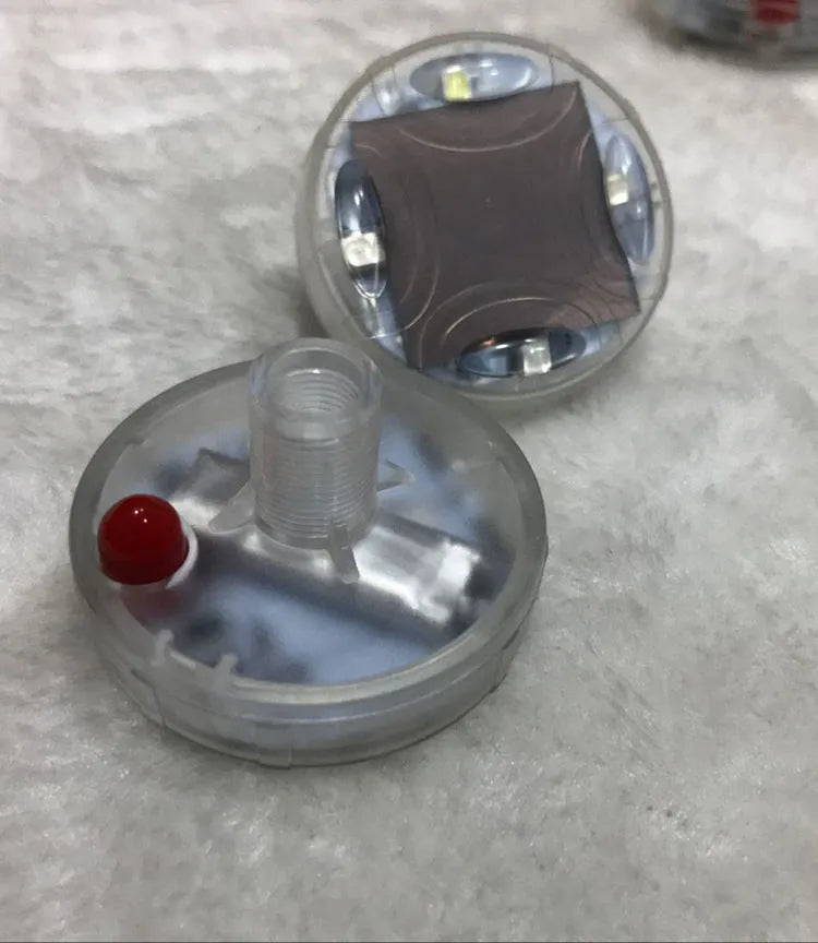 Solar-powered colourful LED valve light for mounting on a vehicle wheel hub.
