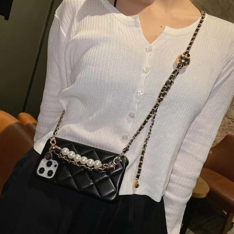Xiaoxiangfeng imitation leather iPhone case with adjustable cross-body strap and small golden ball detail.