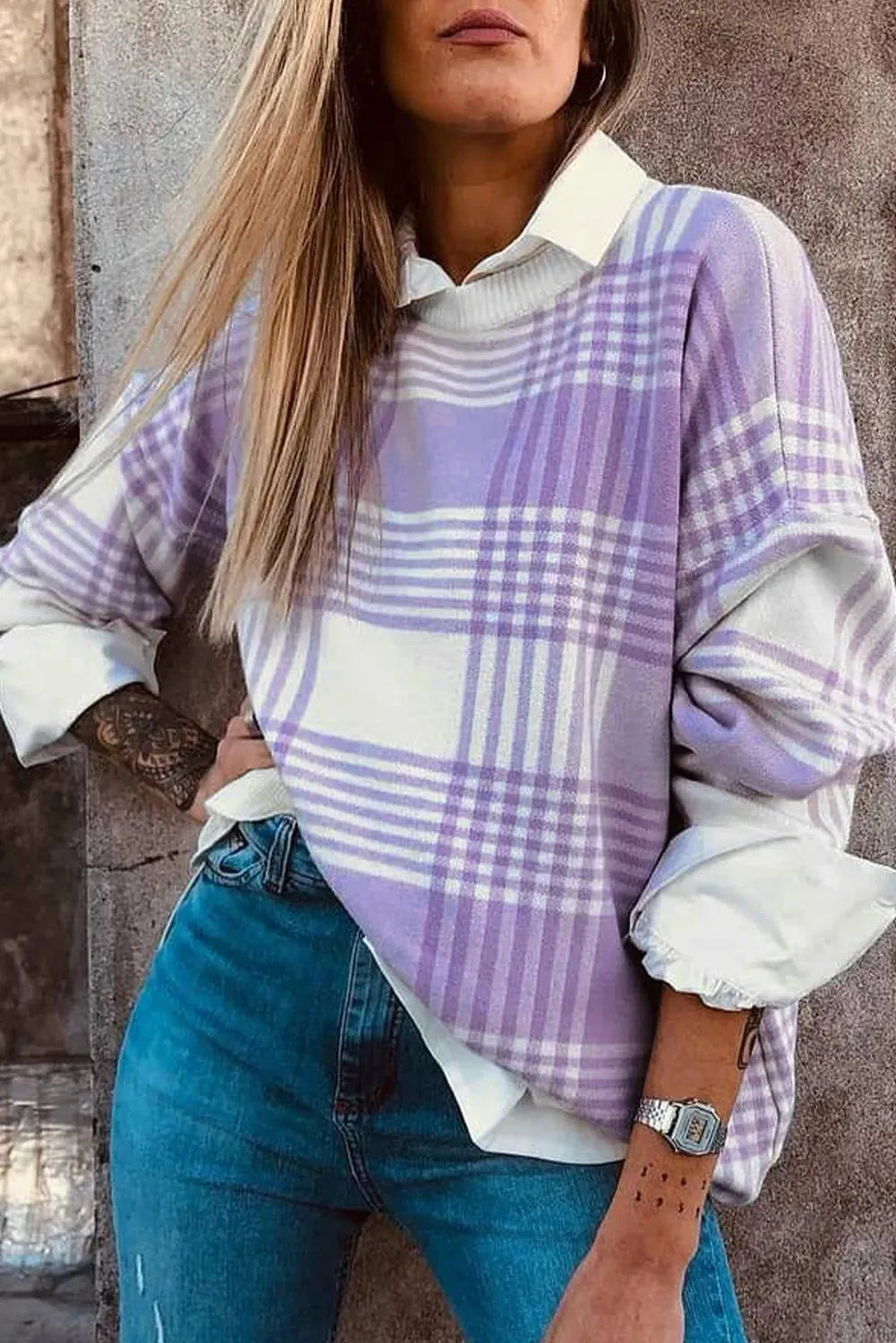 Lilac plaid print loose sweater with ribbed trim and long sleeves on hanger