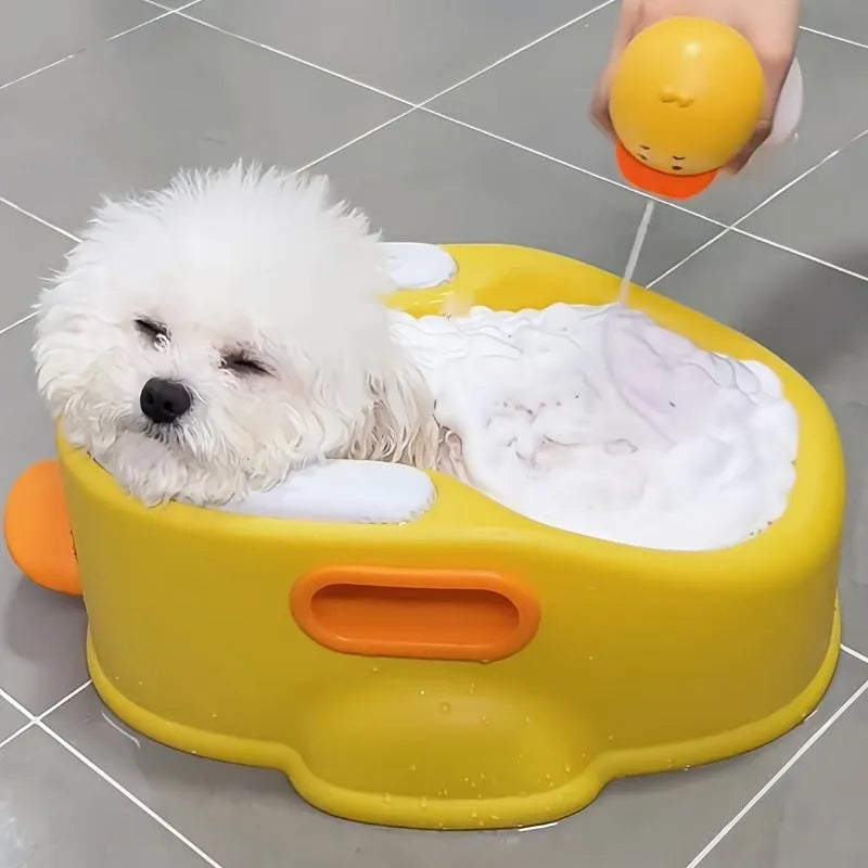 Blue PVC duck-shaped bathtub for washing dogs and cats on grass