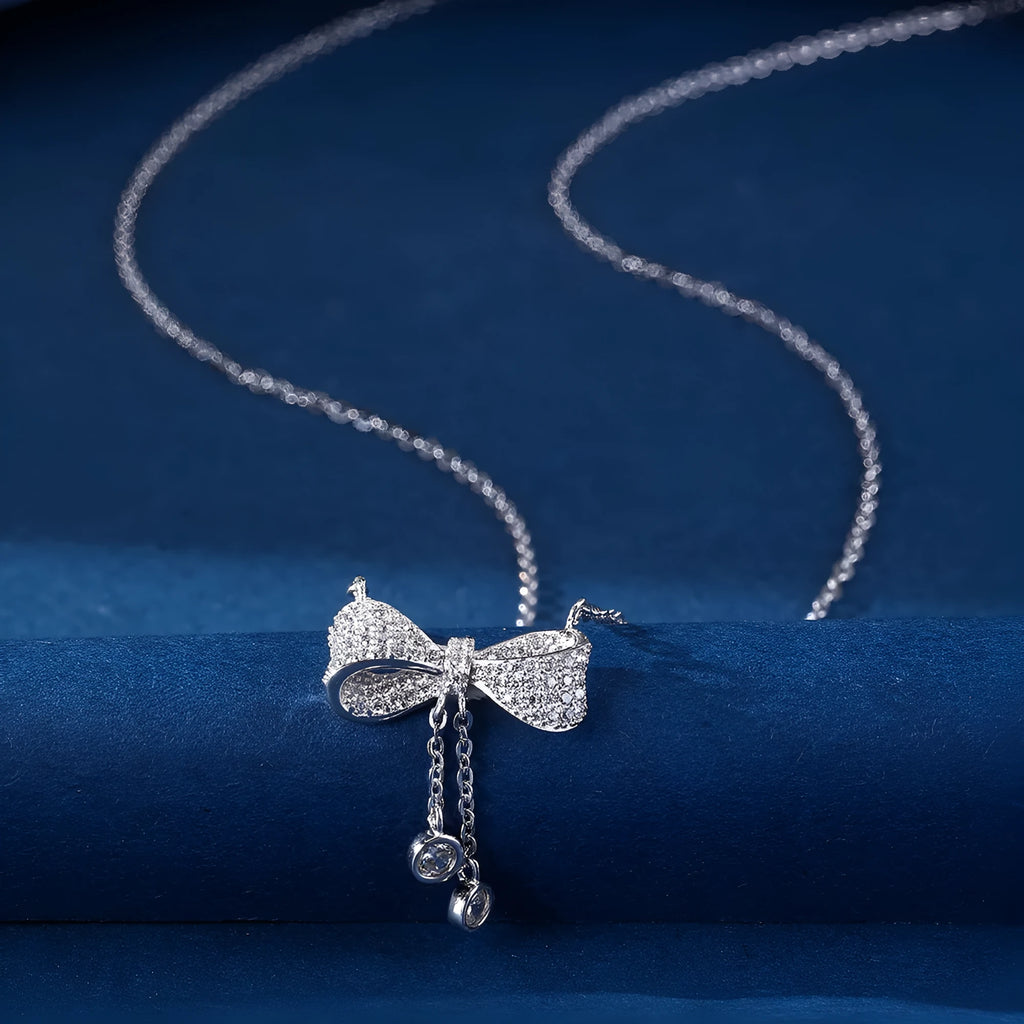 Sterling silver bow pendant necklace on O-ring chain with adjustable 40-45cm length
