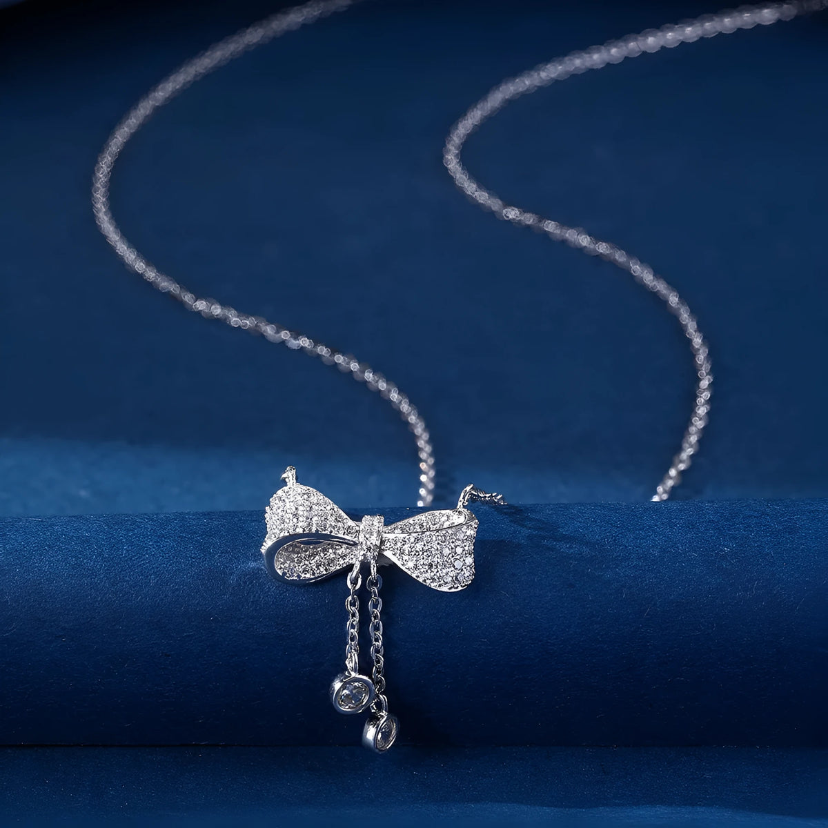 Sterling silver bow pendant necklace on O-ring chain with adjustable 40-45cm length