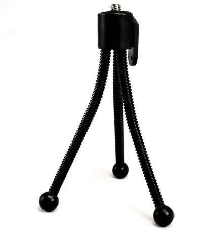 Small iron desktop tripod with ball head in folded position showing compact size