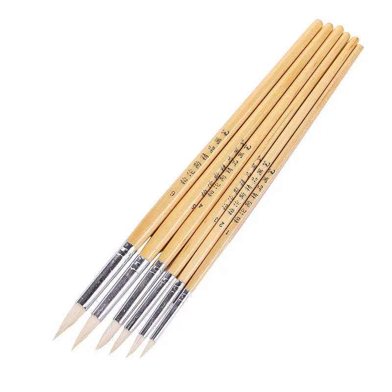 Six wooden-handled artistic brushes with wool-pointed tips for textile and embroidery crafts.