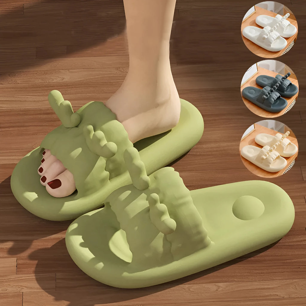 Pair of light-coloured EVA flip flop slippers with hollow-out design and textured sole.
