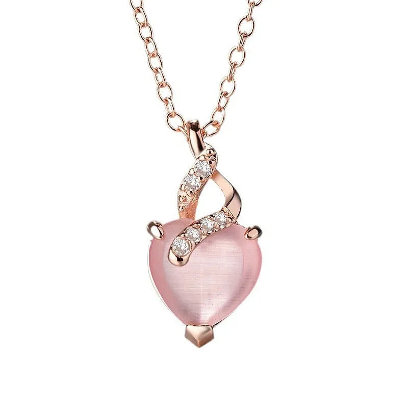 Heart-shaped pink crystal pendant necklace with rose gold cross chain for women