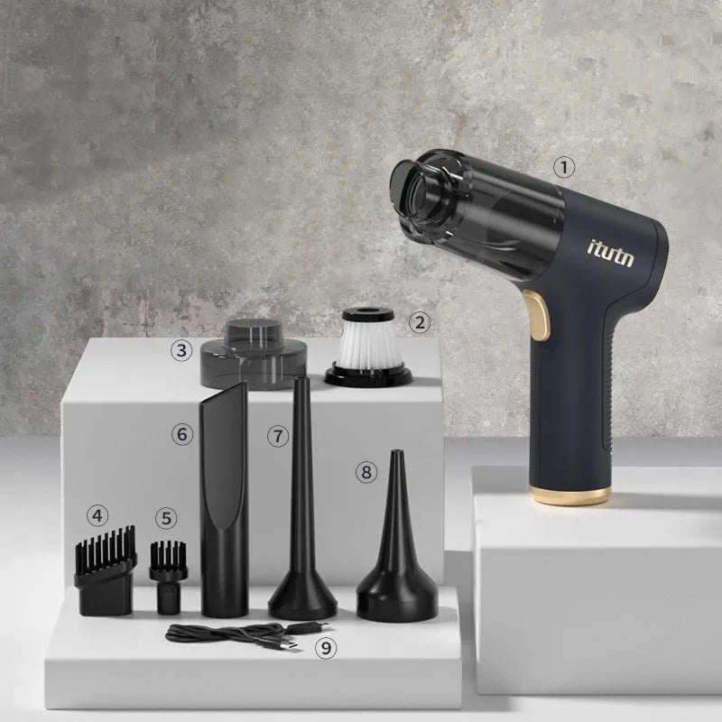Black wireless car vacuum cleaner with multiple nozzle attachments and a USB charging cable on a car seat.