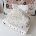 Cotton fabric floral tissue box cover in Chinese pastoral style on a table.