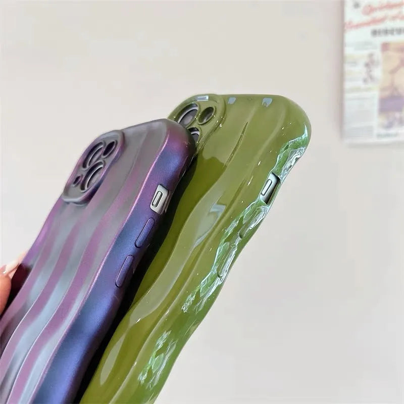 Silicone iPhone case with water ripple texture in burgundy colour on a table.