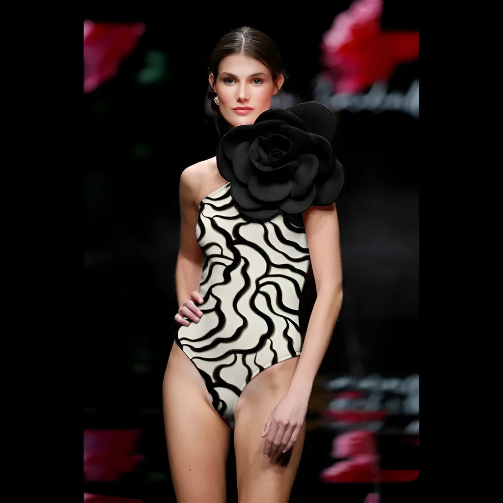 One-piece floral swimsuit in a solid colour with a skirt option on a mannequin.